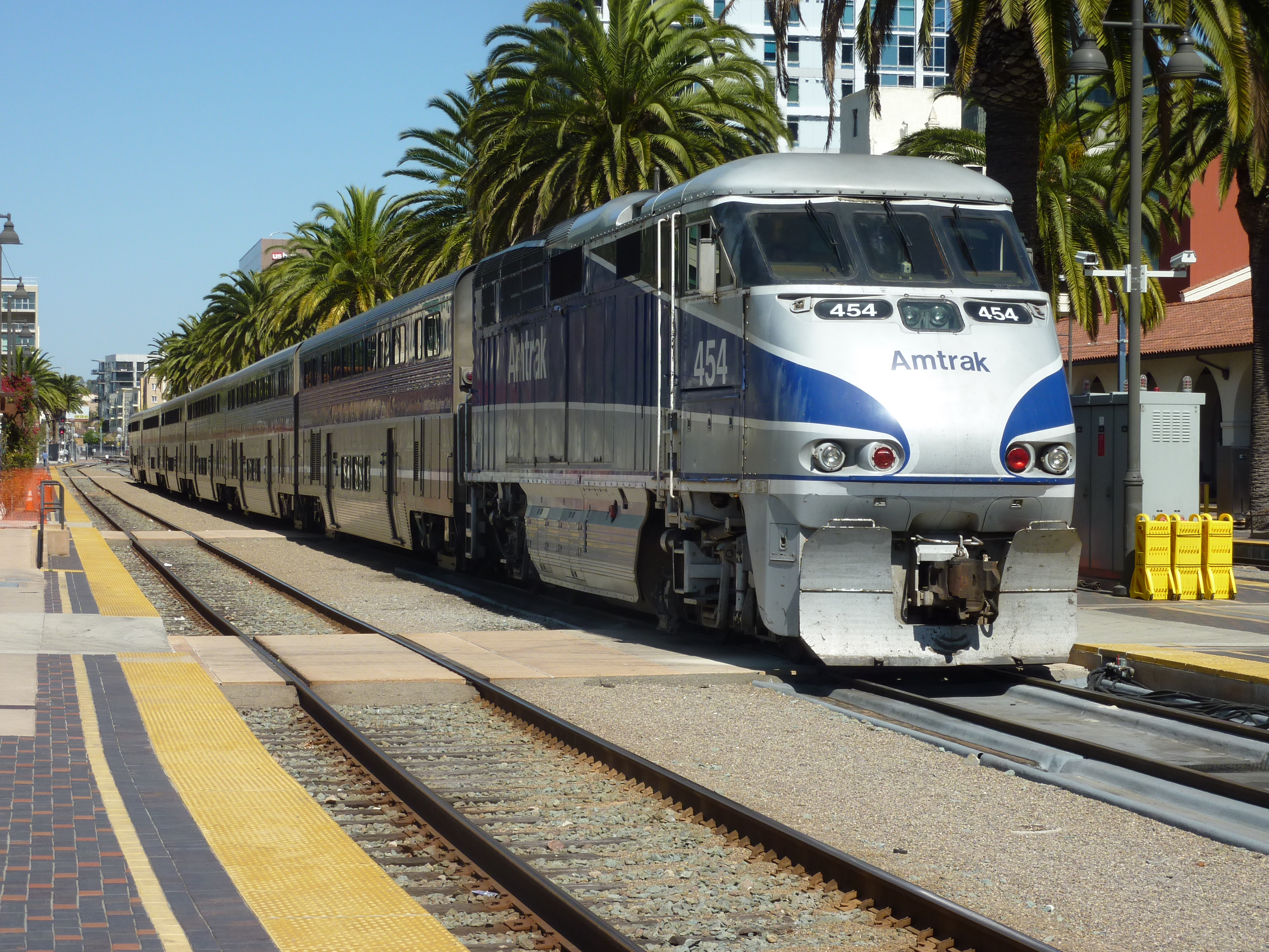 An EMD F59PHI locomotive hauls double deck Surfliner cars on Amtrak Califor...