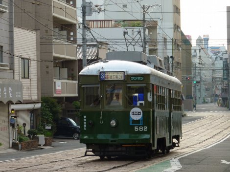 A Hiroden tram stands at the Kagoshima-Cho stop at about 6:30am