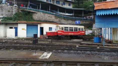 The railcar stands at Shimla station